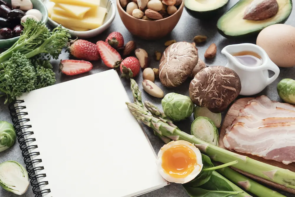 notepad surrounded by food items